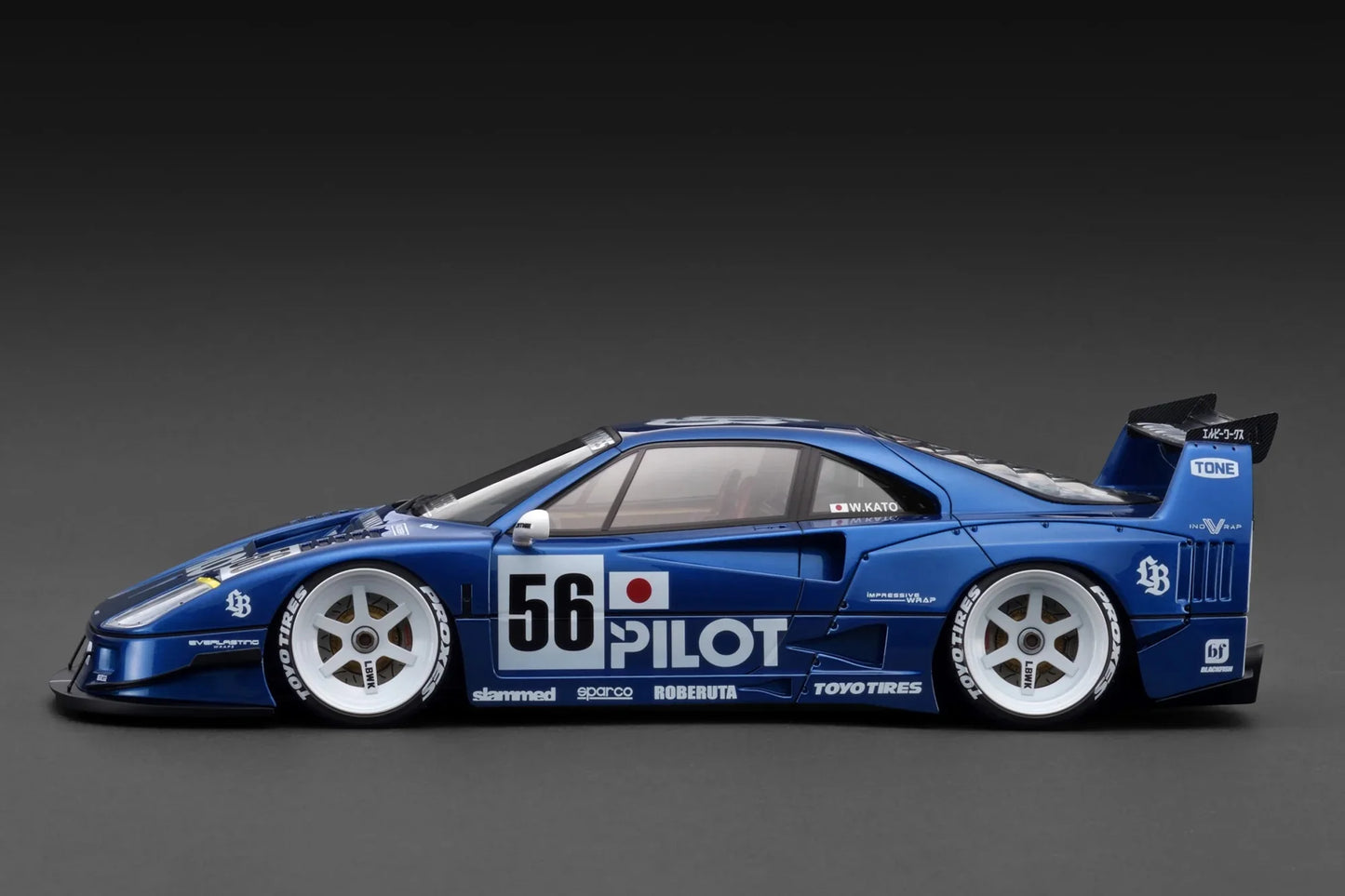 Blue race car with visible branding on a gray background