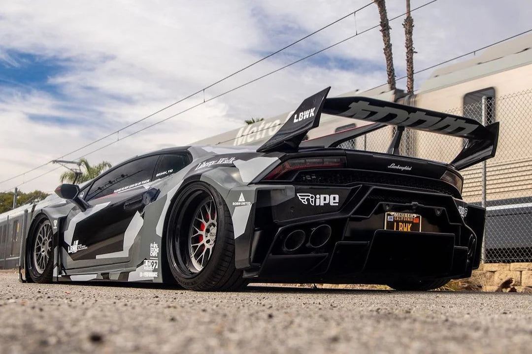 High-performance sports car with a large rear wing on a track