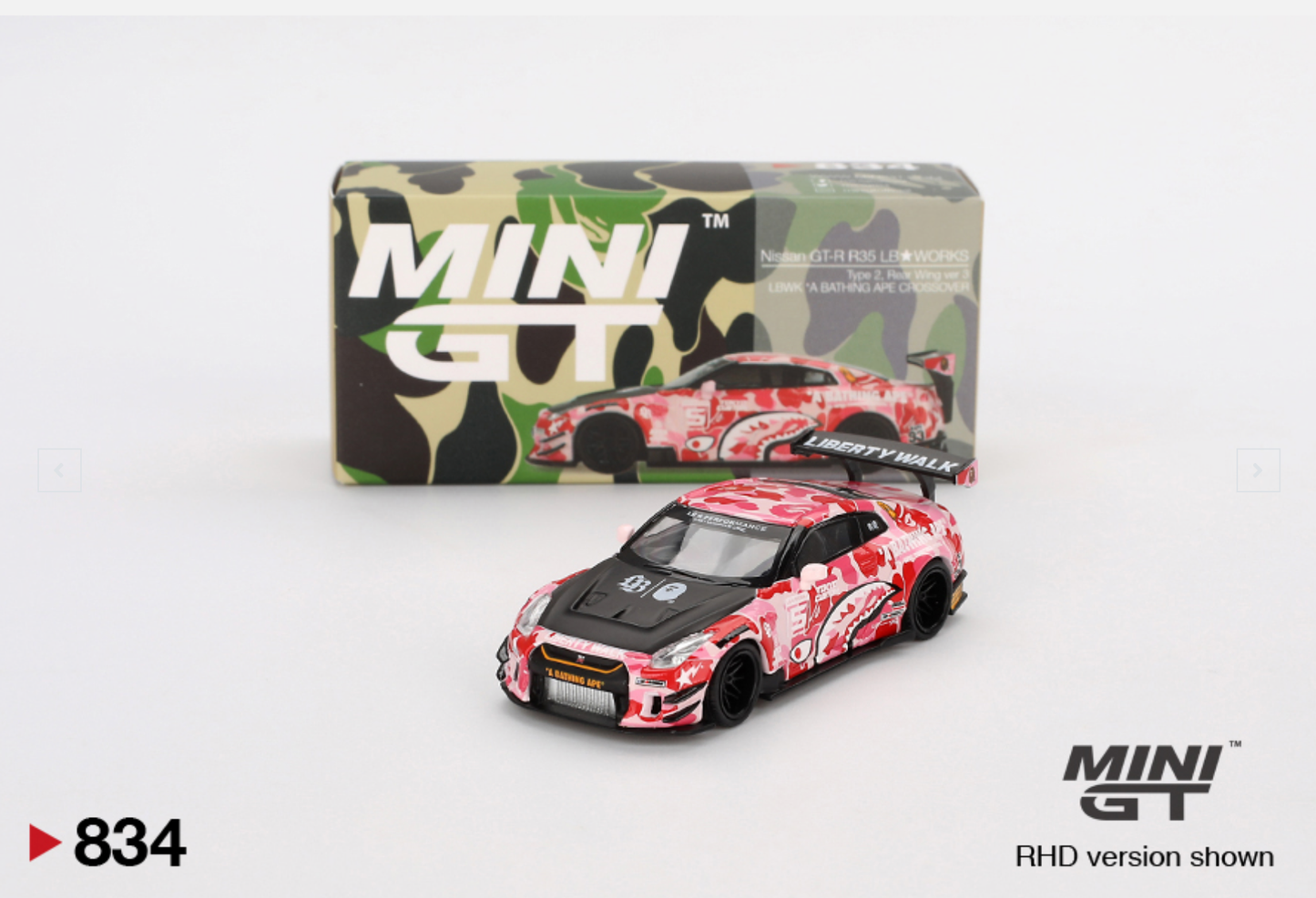 Mini GT model car with camouflage design and packaging on a white background