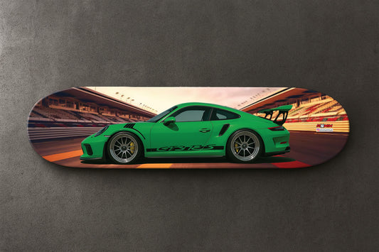 Skateboard deck with a Green Porsche GT3 RS sports car design on a gray background