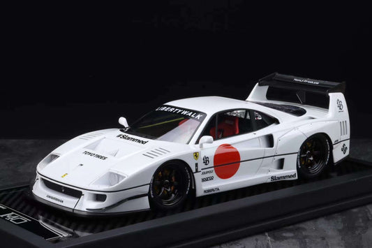 Model of a white sports car with red accents on a black platform