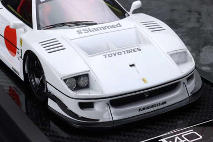 White sports car with branding on a black surface