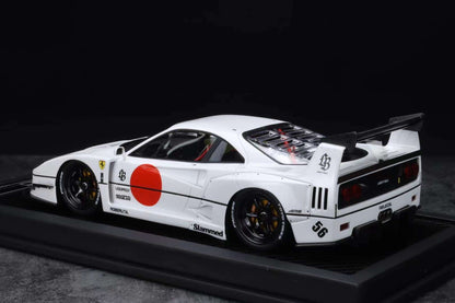 Model car with a white body and red accents on a black background