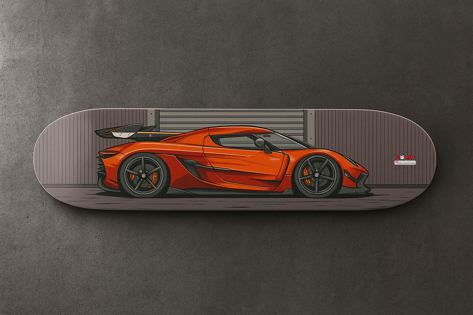 Orange Koenigsegg Jesko sports car on a skateboard deck against a gray background