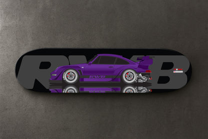 Purple RWB Porsche car design on a skateboard deck with 'RWB' branding.