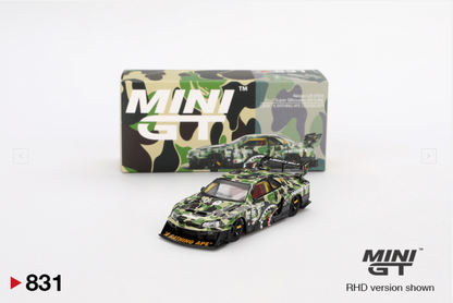 Camouflage model car with packaging and MINI GT branding on a white background