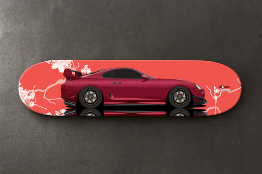 Red Supra MK4 sports car design on a skateboard deck with a gray background
