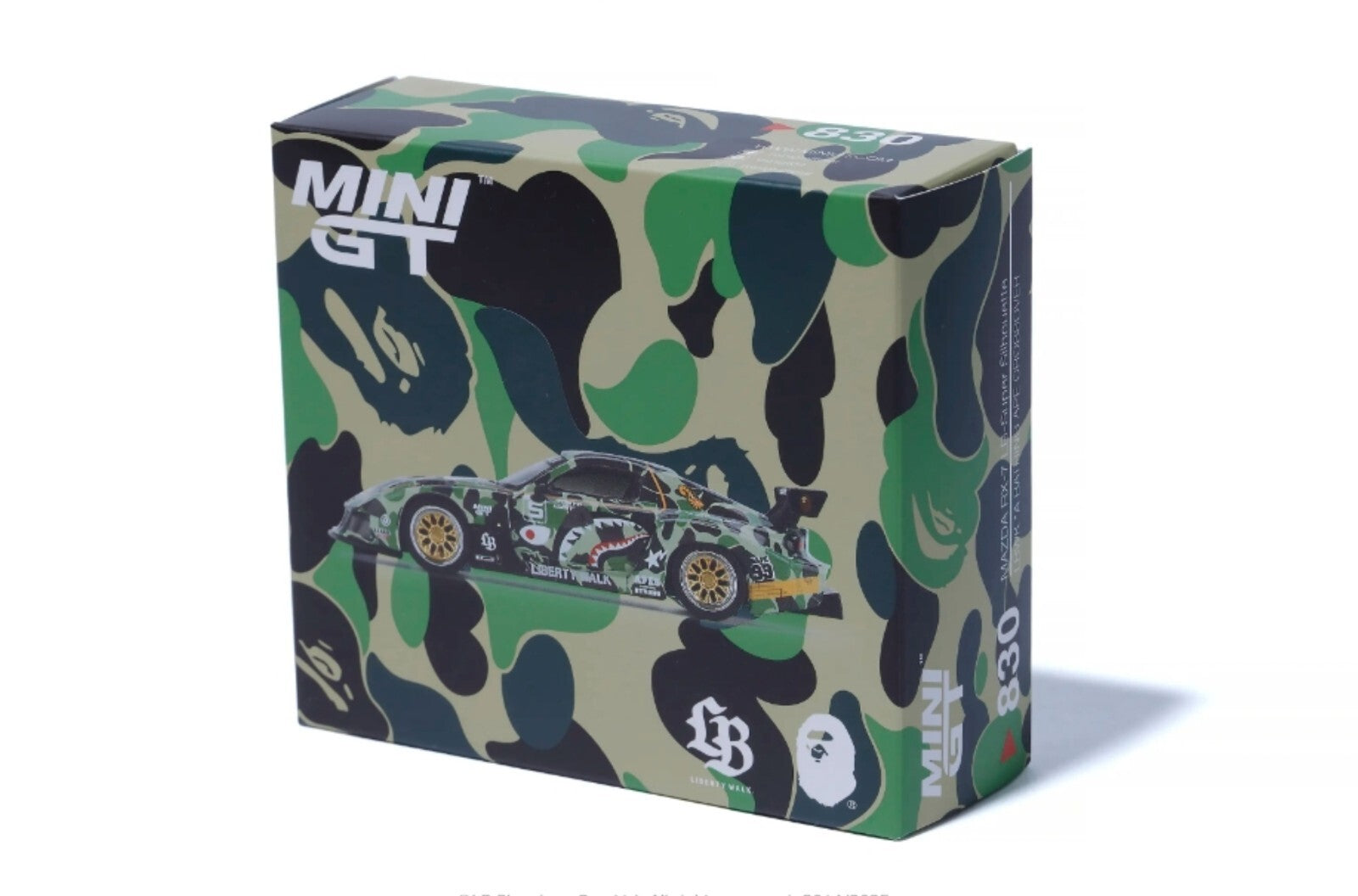 Camouflage-patterned box with 'MINI GT' branding and a car illustration on a white background