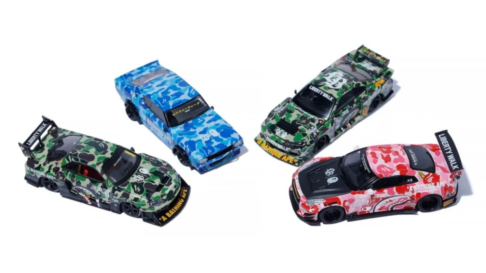 Four colorful model cars on a white background