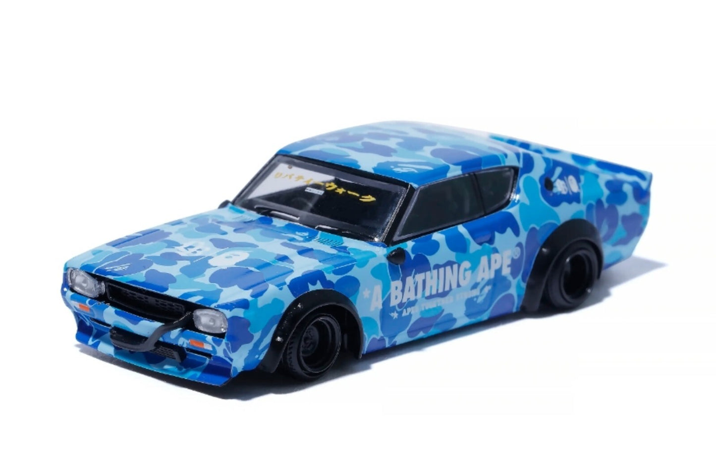 Blue camouflage toy car with 'Bathing Ape' branding on a white background