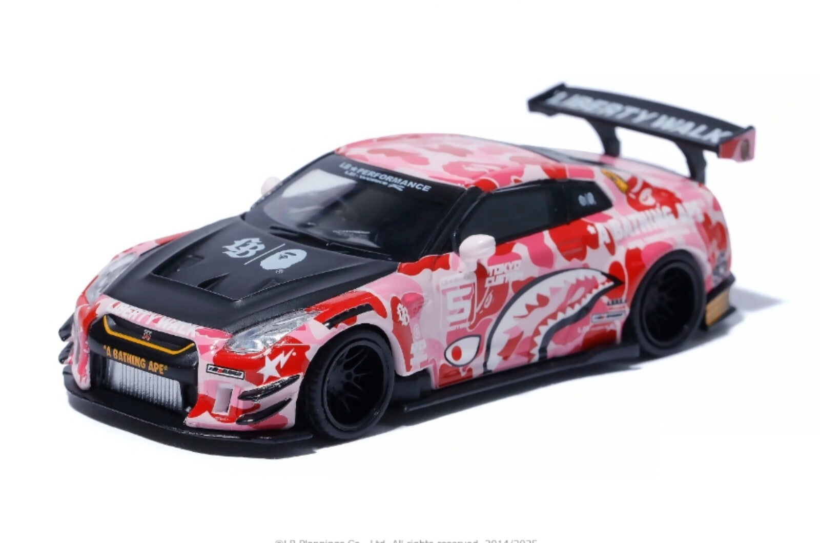 Model car with a red and black design on a white background